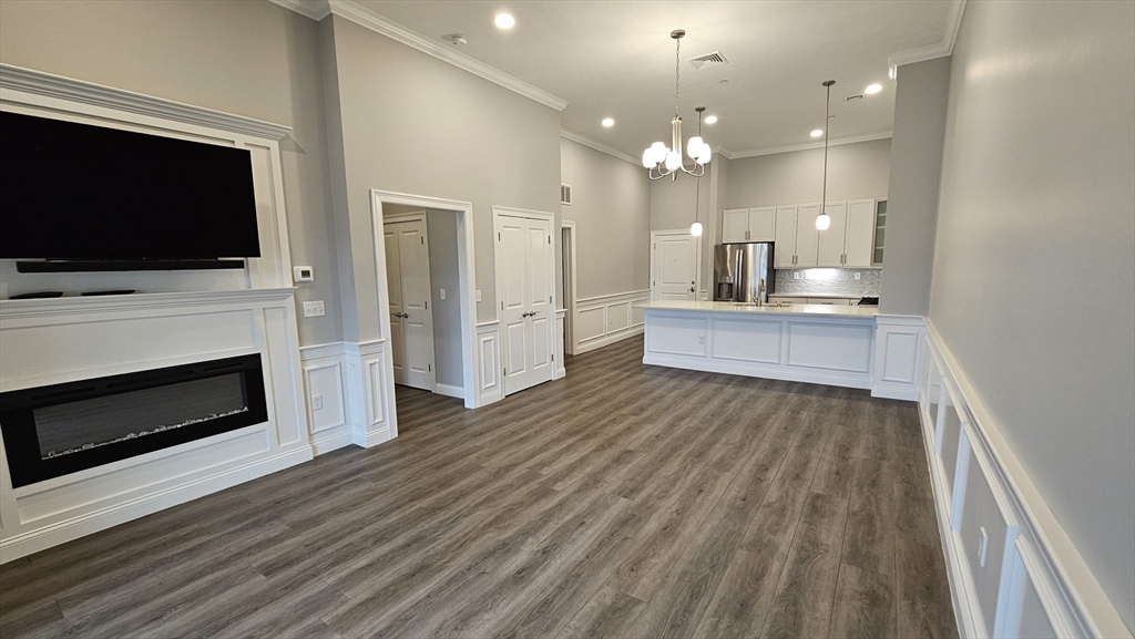 a view of kitchen with microwave oven and stove