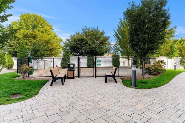 a view of a park with bench sitting