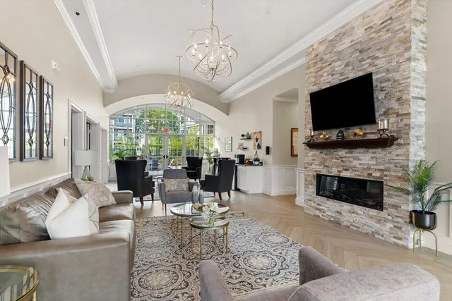 a living room with fireplace furniture and a flat screen tv