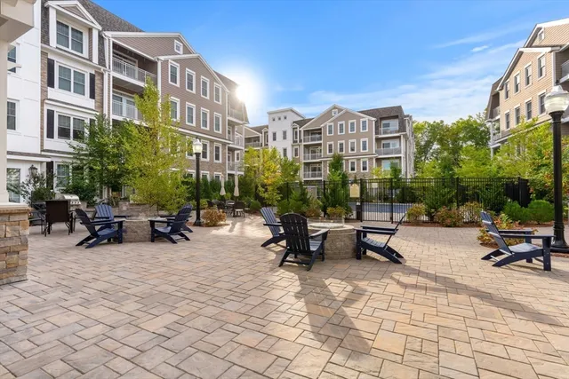 a view of a building with sitting area