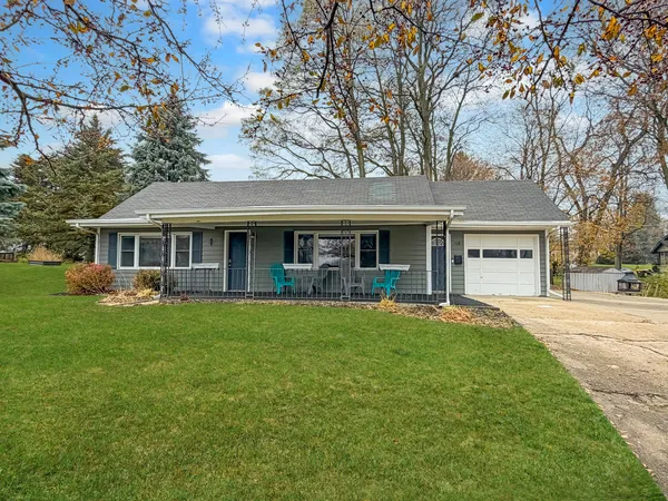 front view of a house with a garden