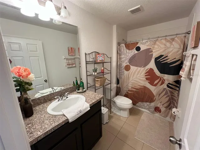 a living room with a bed furniture and a window