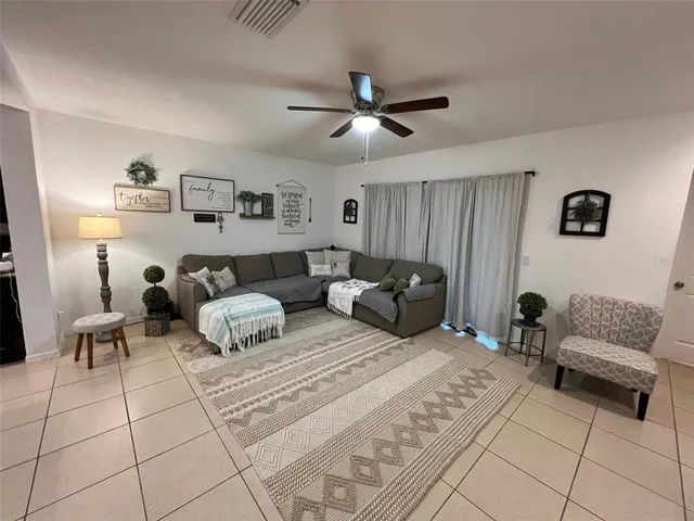 a spacious bedroom with a bed and window