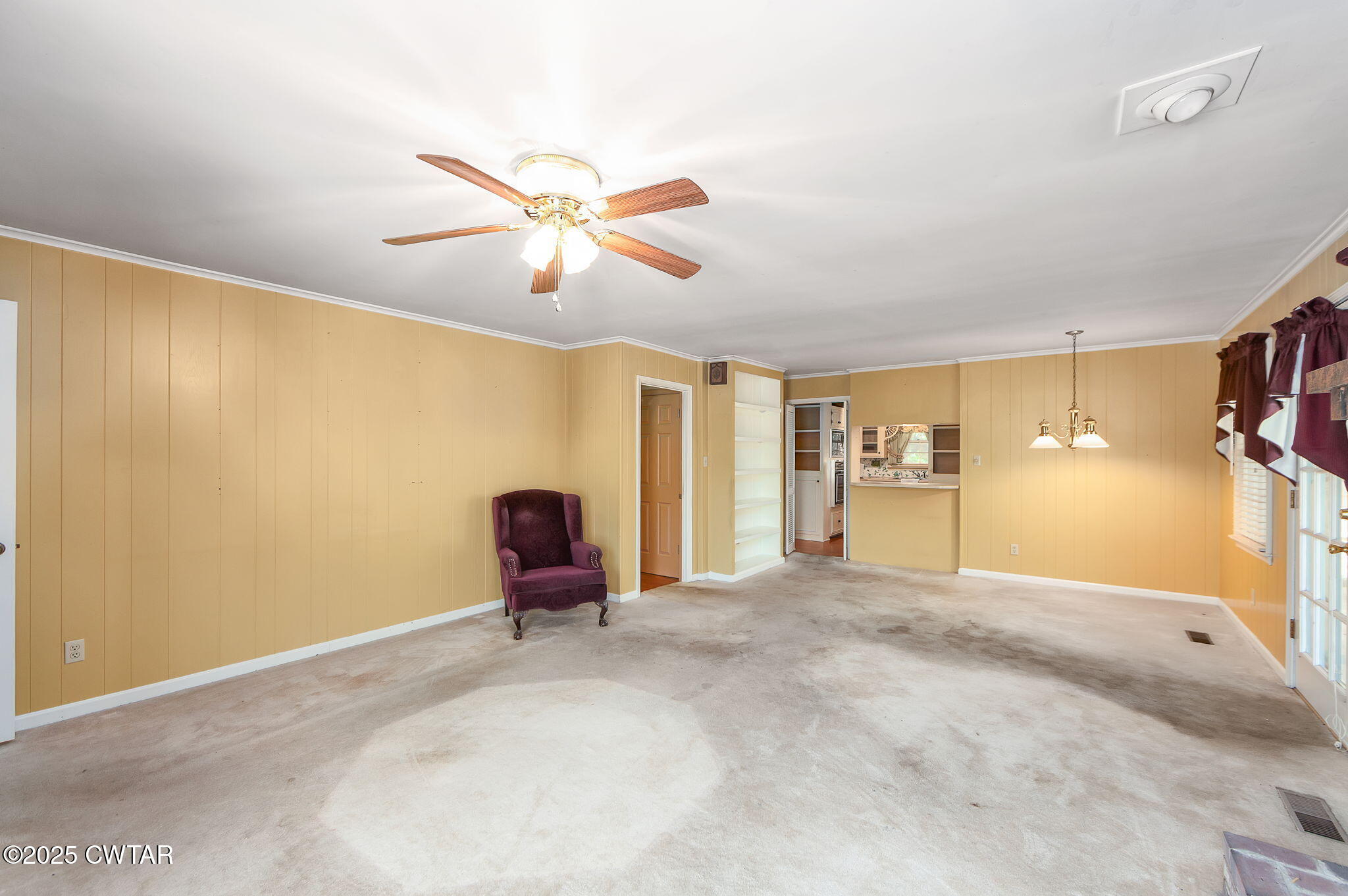 22 Bethany Drive Jackson, TN 38301 - Photo 11 of 32 a view of a livingroom with a chandelier fan and a window