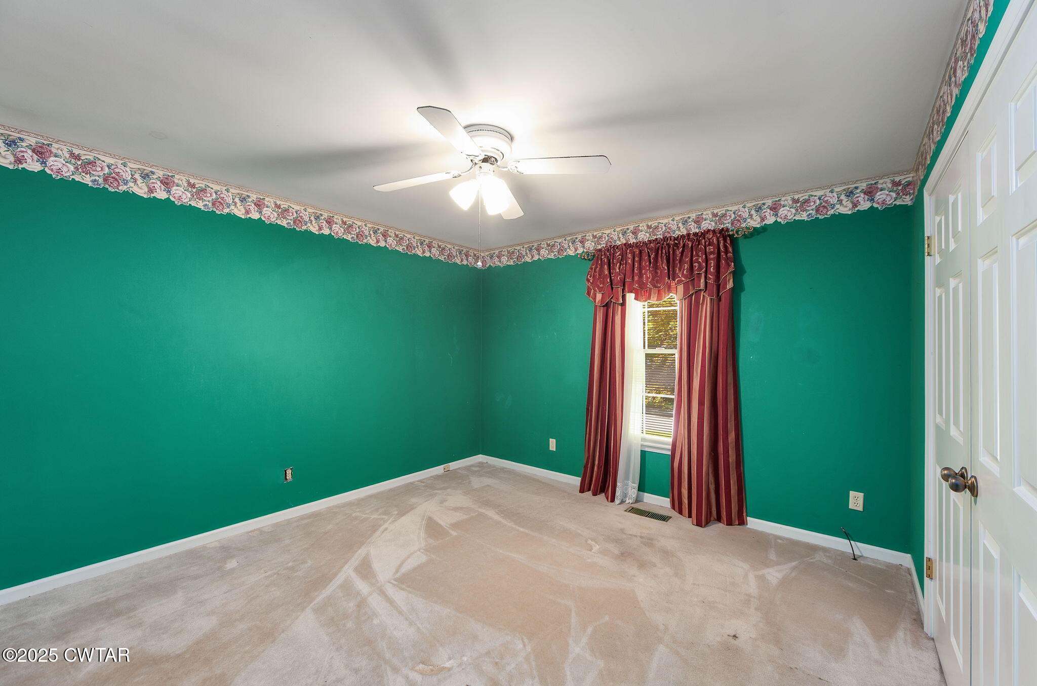 22 Bethany Drive Jackson, TN 38301 - Photo 14 of 32 a view of a bedroom with window and ceiling fan