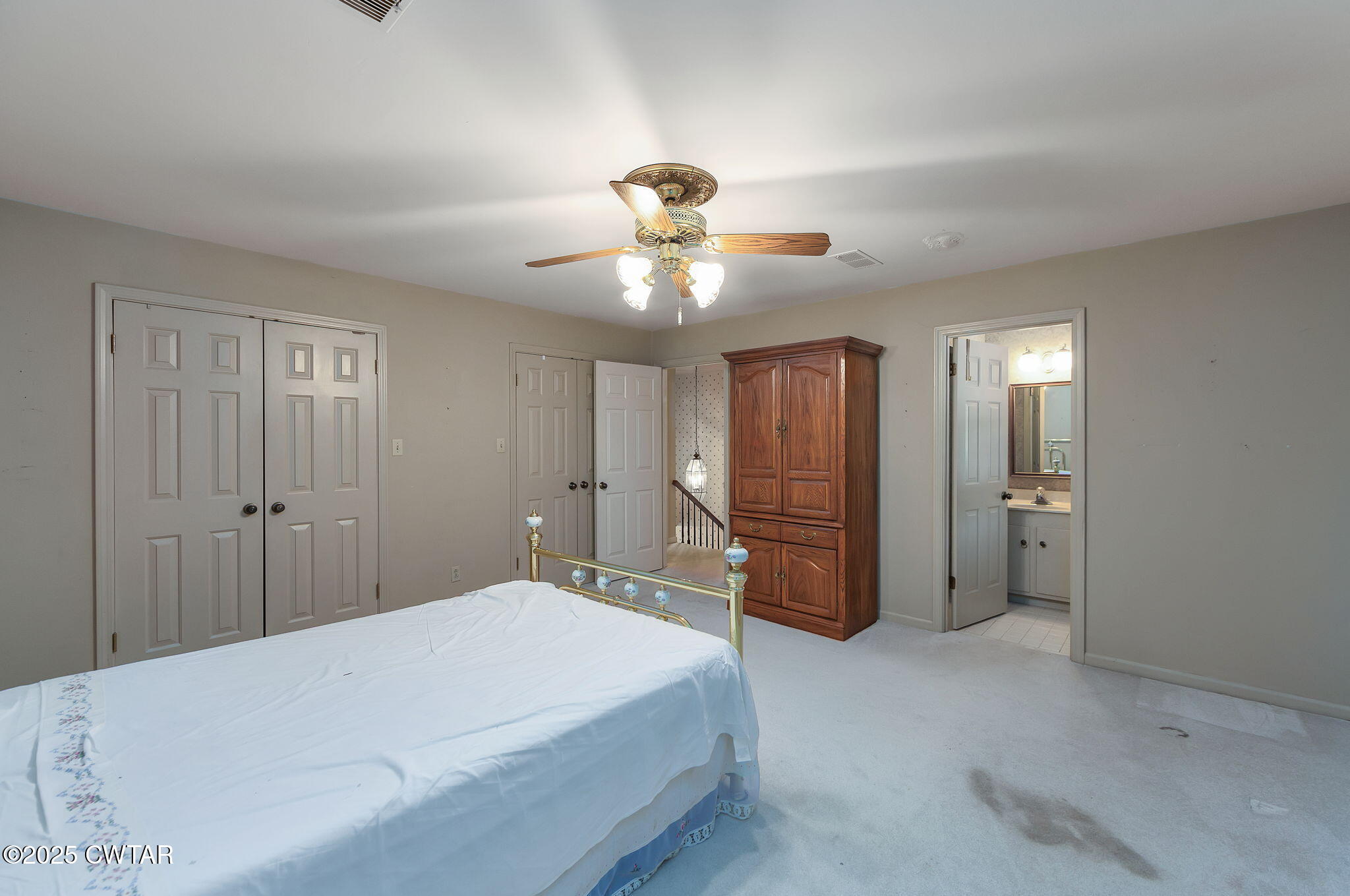 22 Bethany Drive Jackson, TN 38301 - Photo 17 of 32 a bedroom with a chandelier and a chandelier