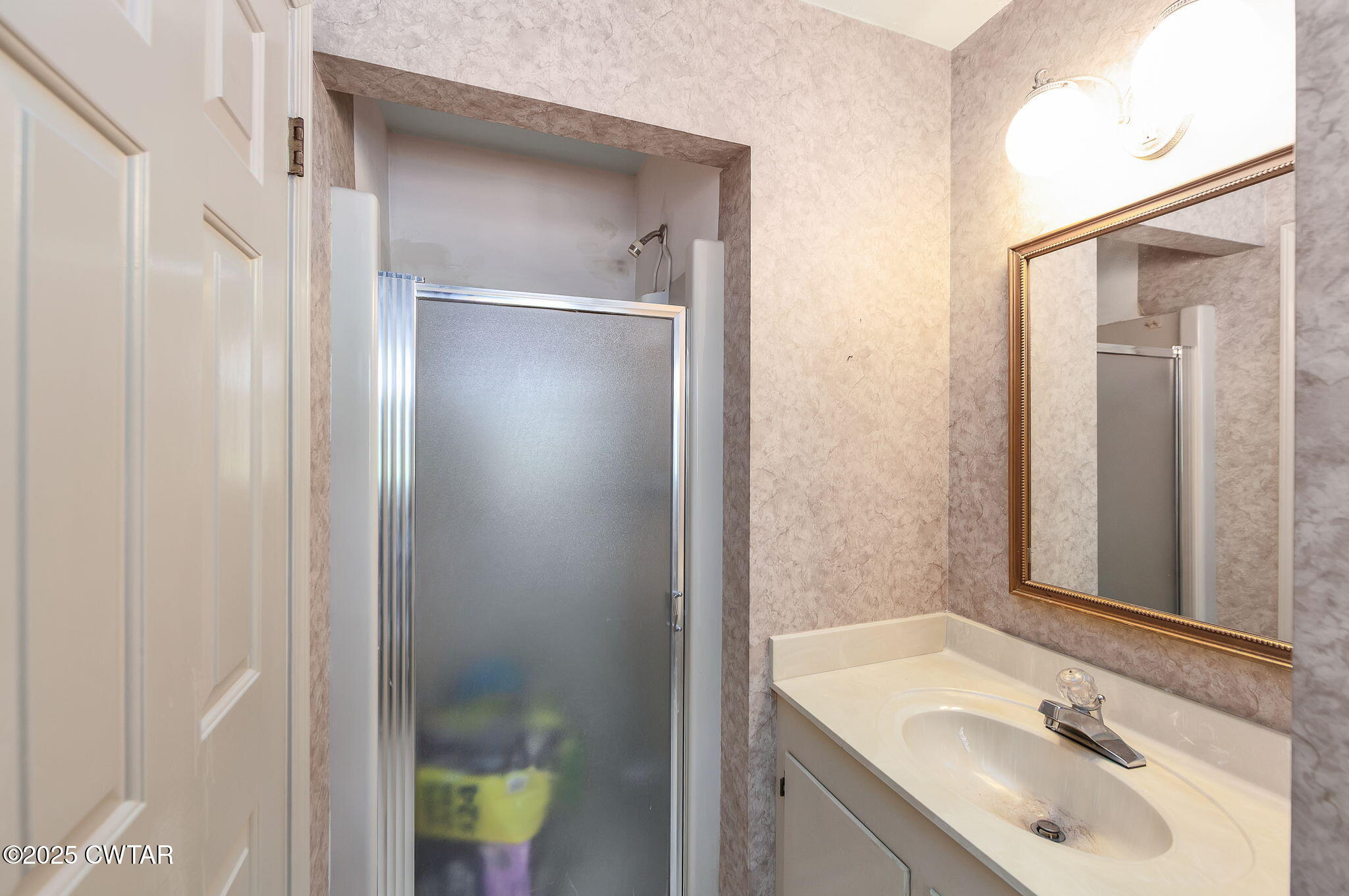 22 Bethany Drive Jackson, TN 38301 - Photo 18 of 32 a bathroom with a sink and a mirror