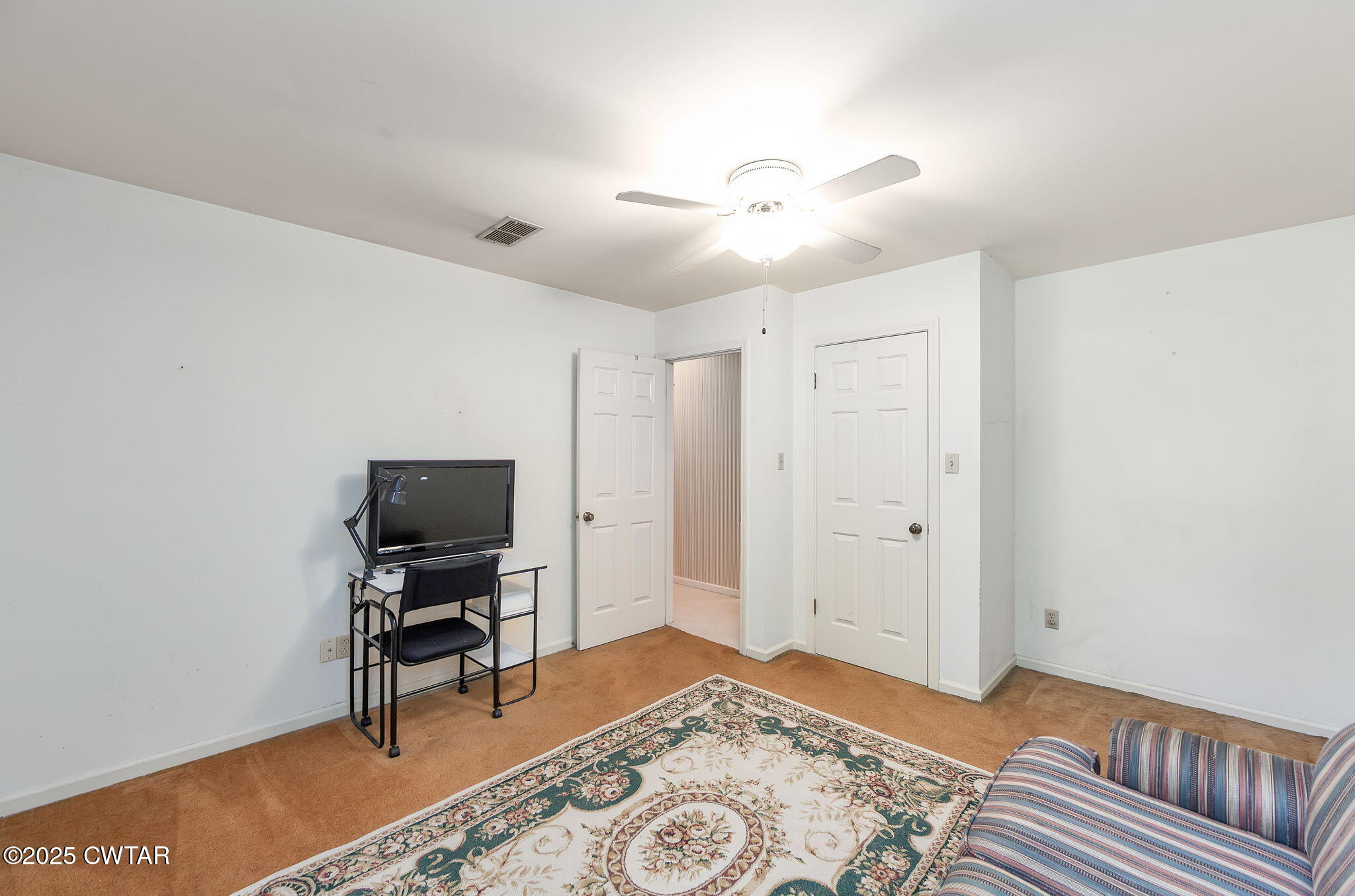 22 Bethany Drive Jackson, TN 38301 - Photo 21 of 32 a bedroom with a bed and a workspace