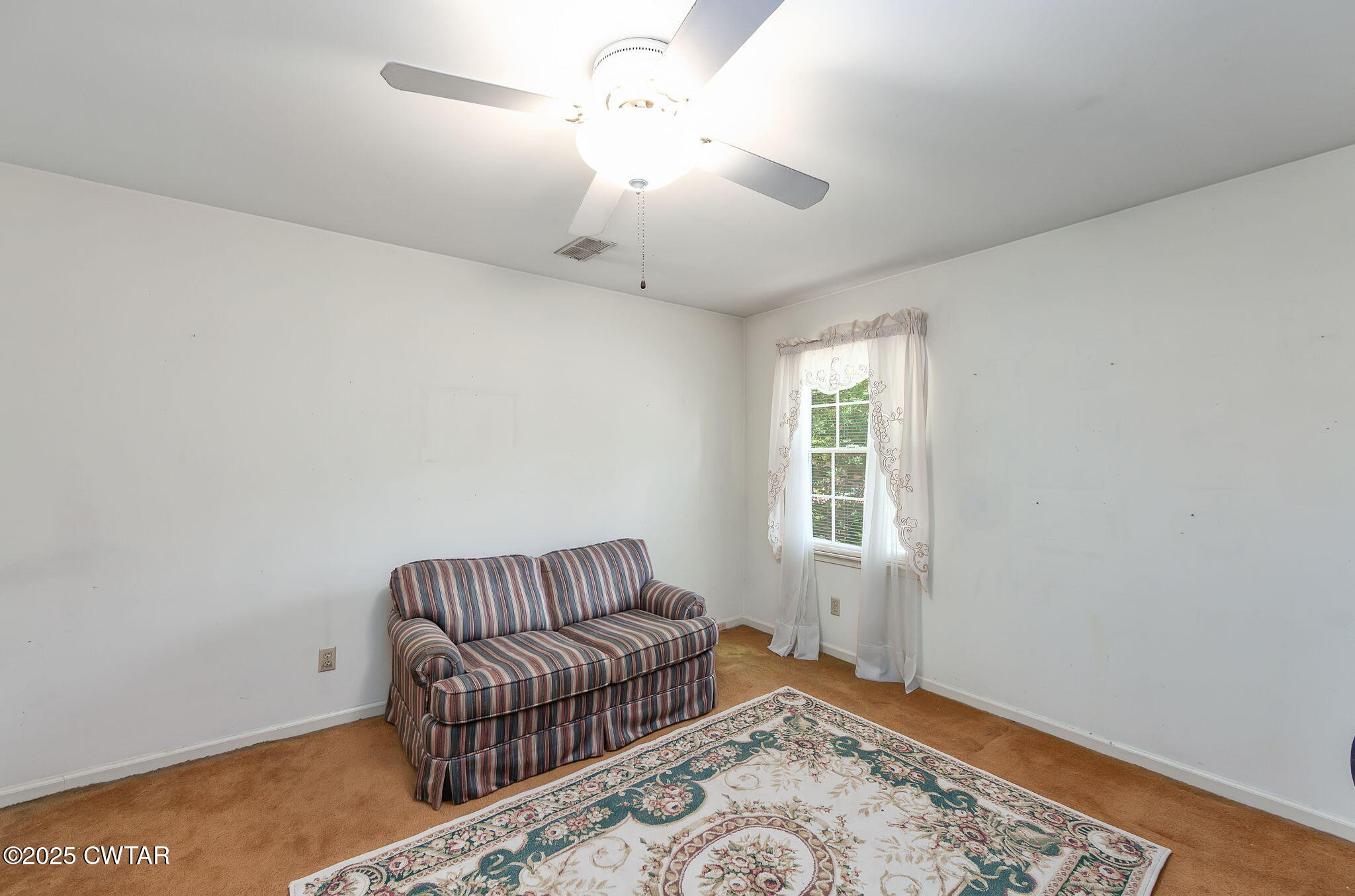 22 Bethany Drive Jackson, TN 38301 - Photo 22 of 32 a living room with furniture and a rug