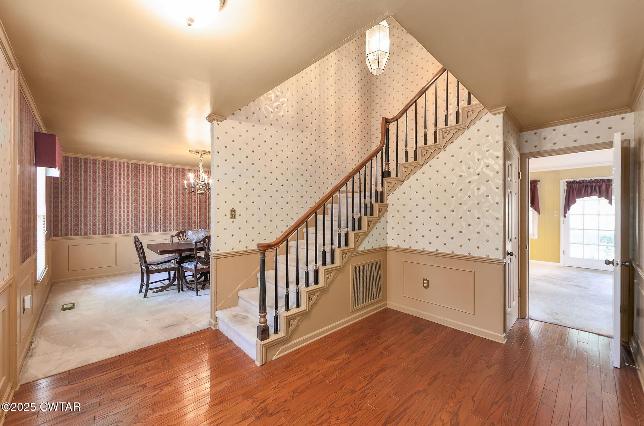 22 Bethany Drive Jackson, TN 38301 - Photo 3 of 32 a view of staircase with wooden floor and a rug