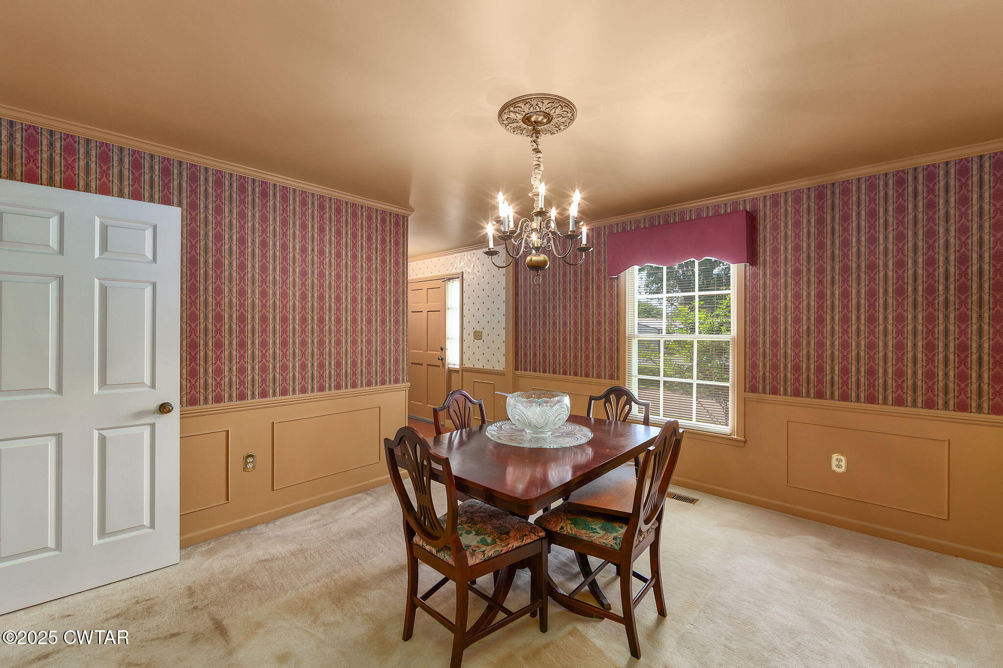 22 Bethany Drive Jackson, TN 38301 - Photo 6 of 32 a view of a dining room with furniture and chandelier