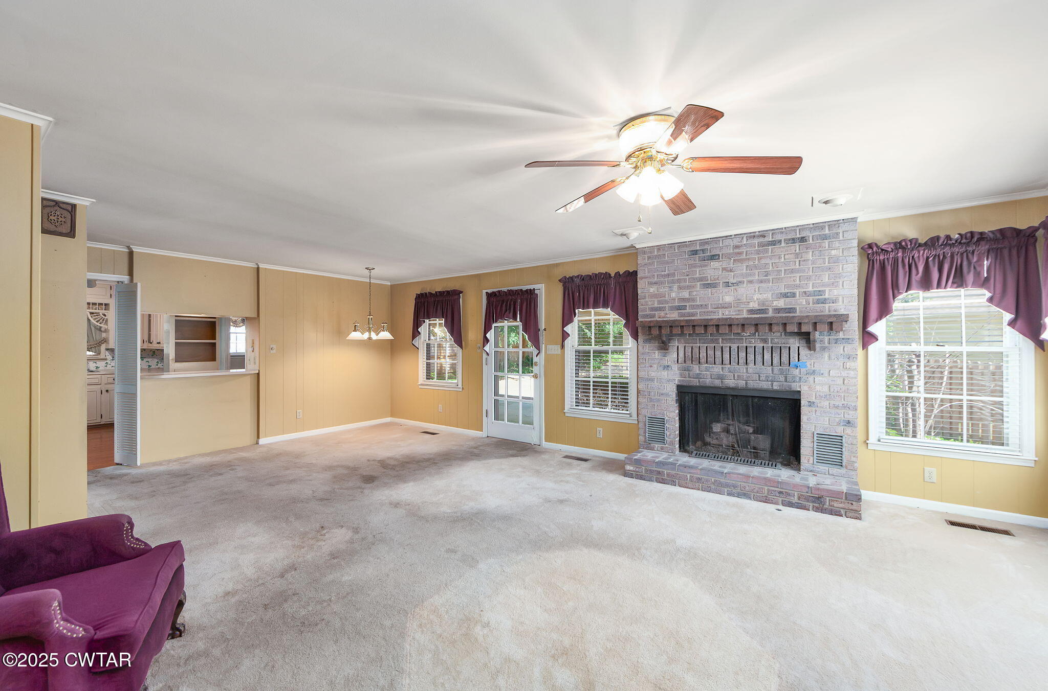 22 Bethany Drive Jackson, TN 38301 - Photo 8 of 32 a view of an empty room with a fireplace and a window