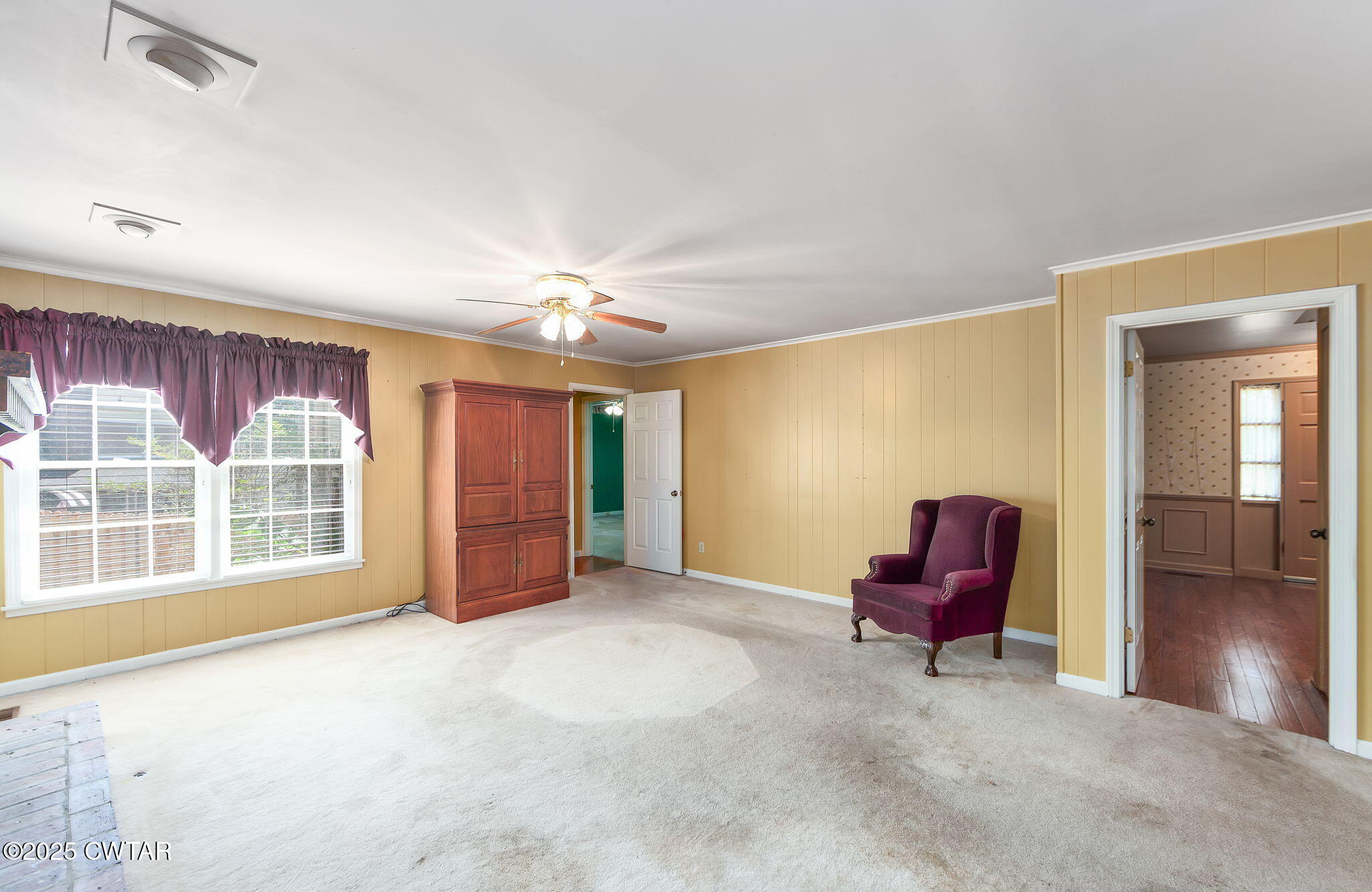 22 Bethany Drive Jackson, TN 38301 - Photo 10 of 32 a view of empty room with wooden floor and fan