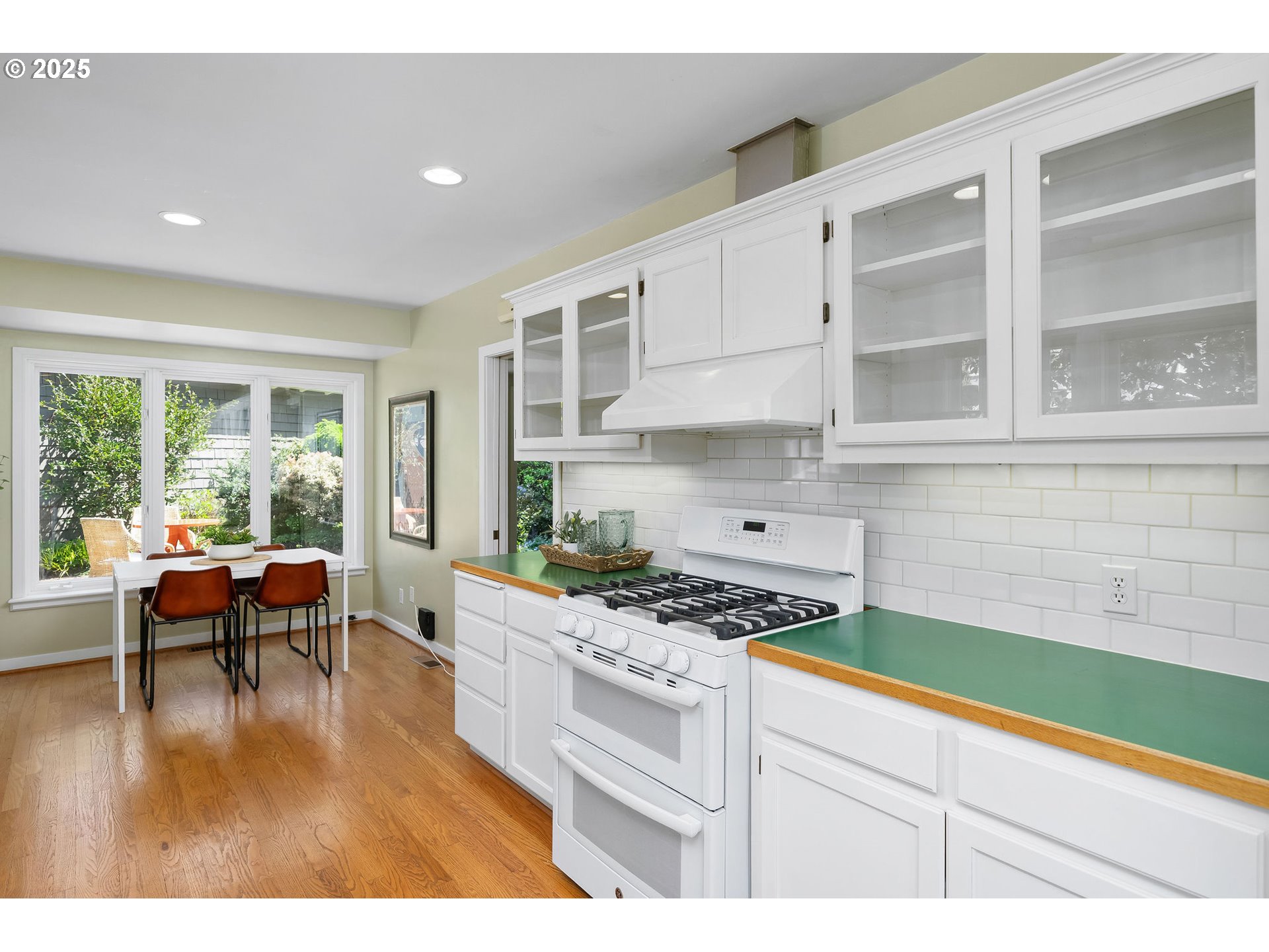 3940 Southwest Council Crest Drive Portland, OR 97239 - Photo 16 of 48 a kitchen with stainless steel appliances kitchen island granite countertop a stove a sink and a microwave