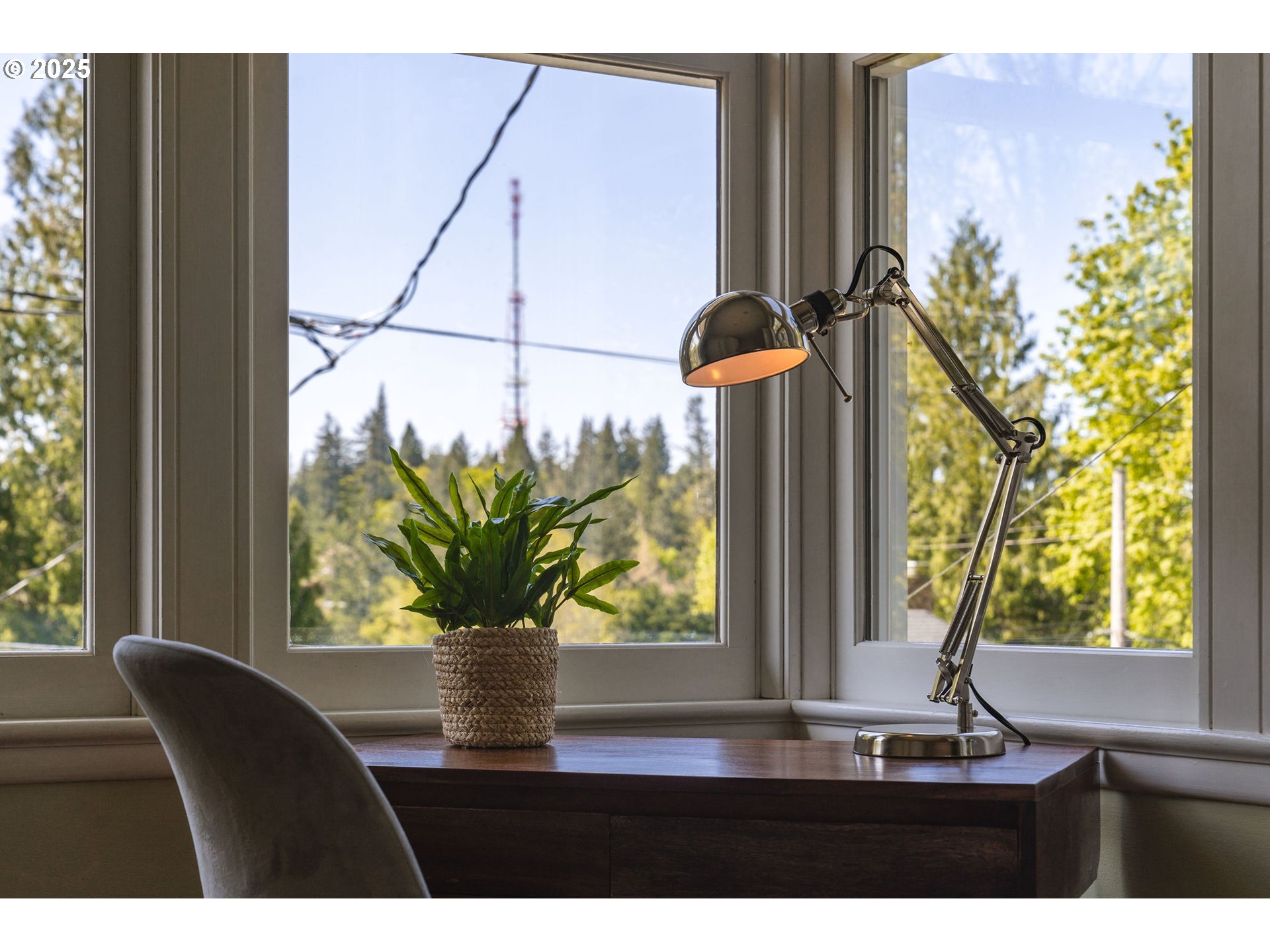 3940 Southwest Council Crest Drive Portland, OR 97239 - Photo 20 of 48 a vase of flowers sitting on a table with wooden floor