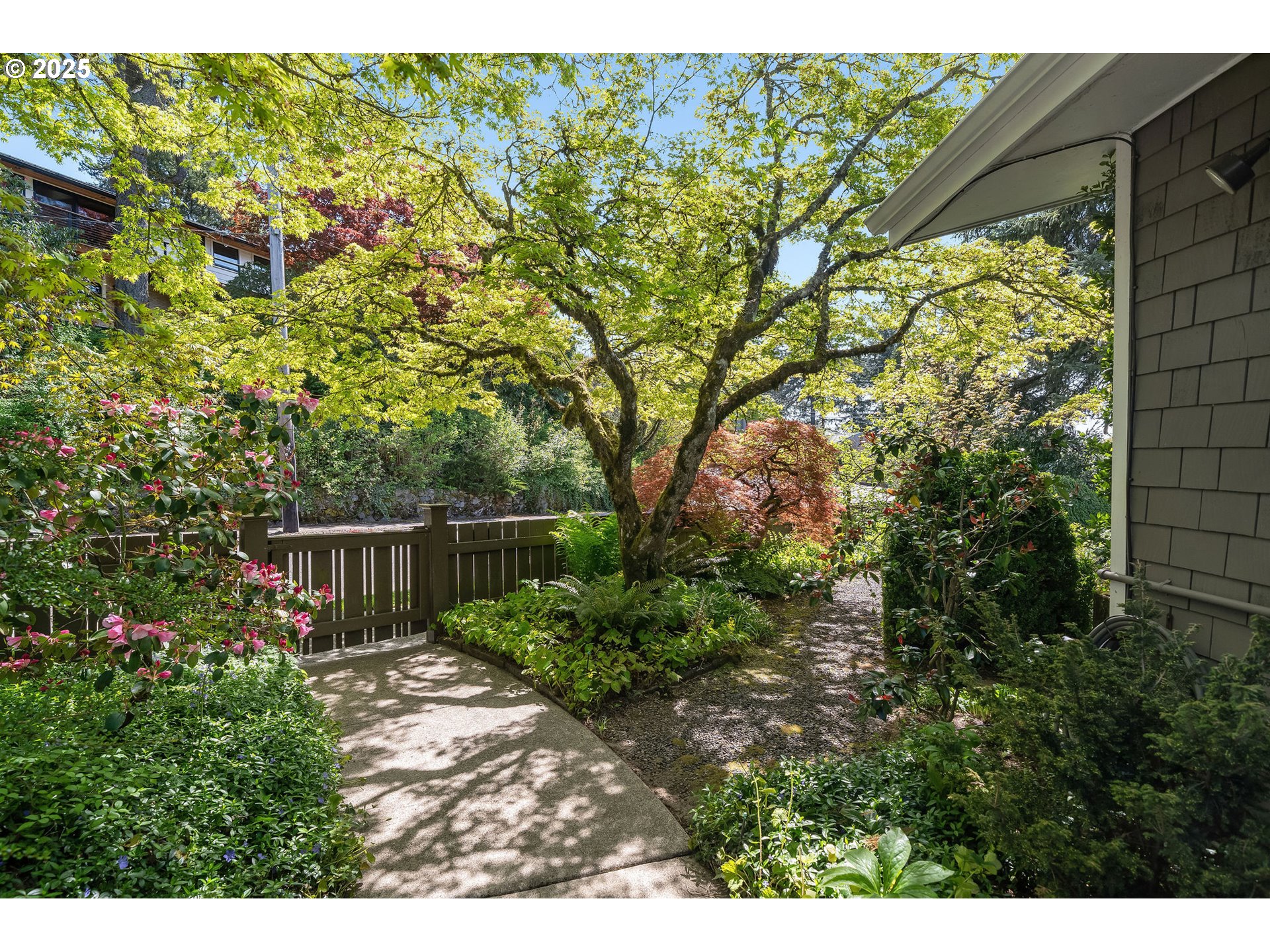3940 Southwest Council Crest Drive Portland, OR 97239 - Photo 2 of 48 a backyard of a house with lots of green space
