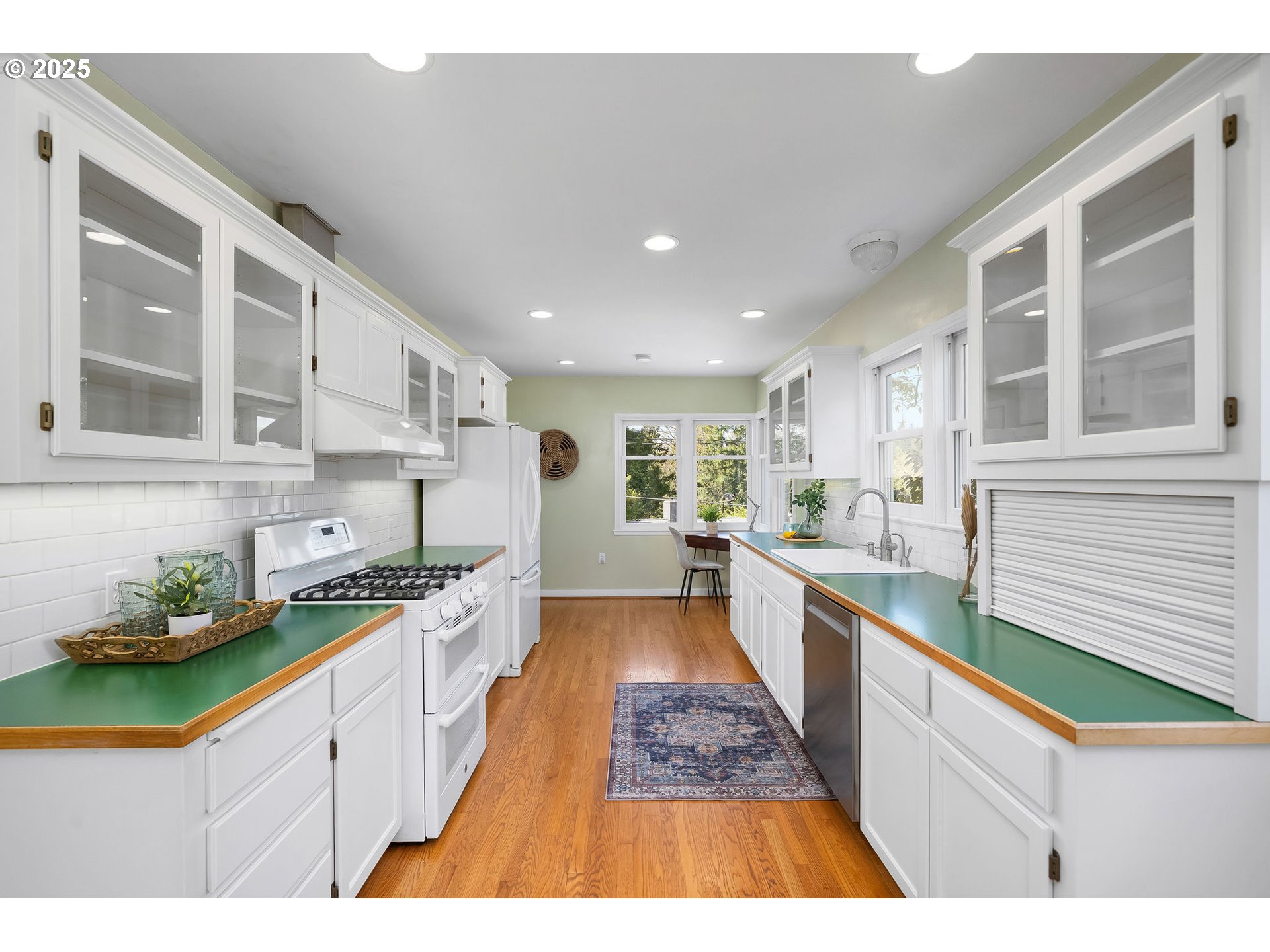 3940 Southwest Council Crest Drive Portland, OR 97239 - Photo 21 of 48 a large kitchen with stainless steel appliances kitchen island a large counter top and a stove