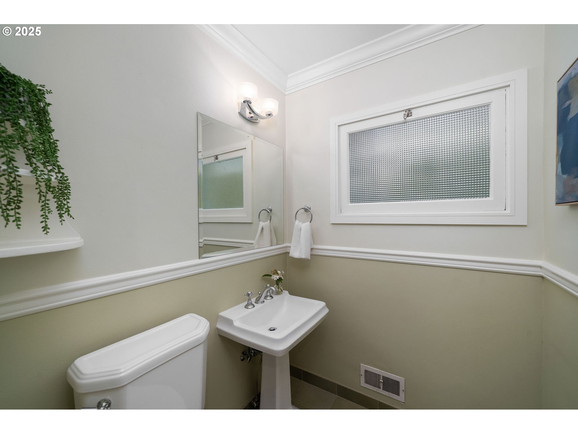 3940 Southwest Council Crest Drive Portland, OR 97239 - Photo 24 of 48 a bathroom with a sink a mirror and a toilet