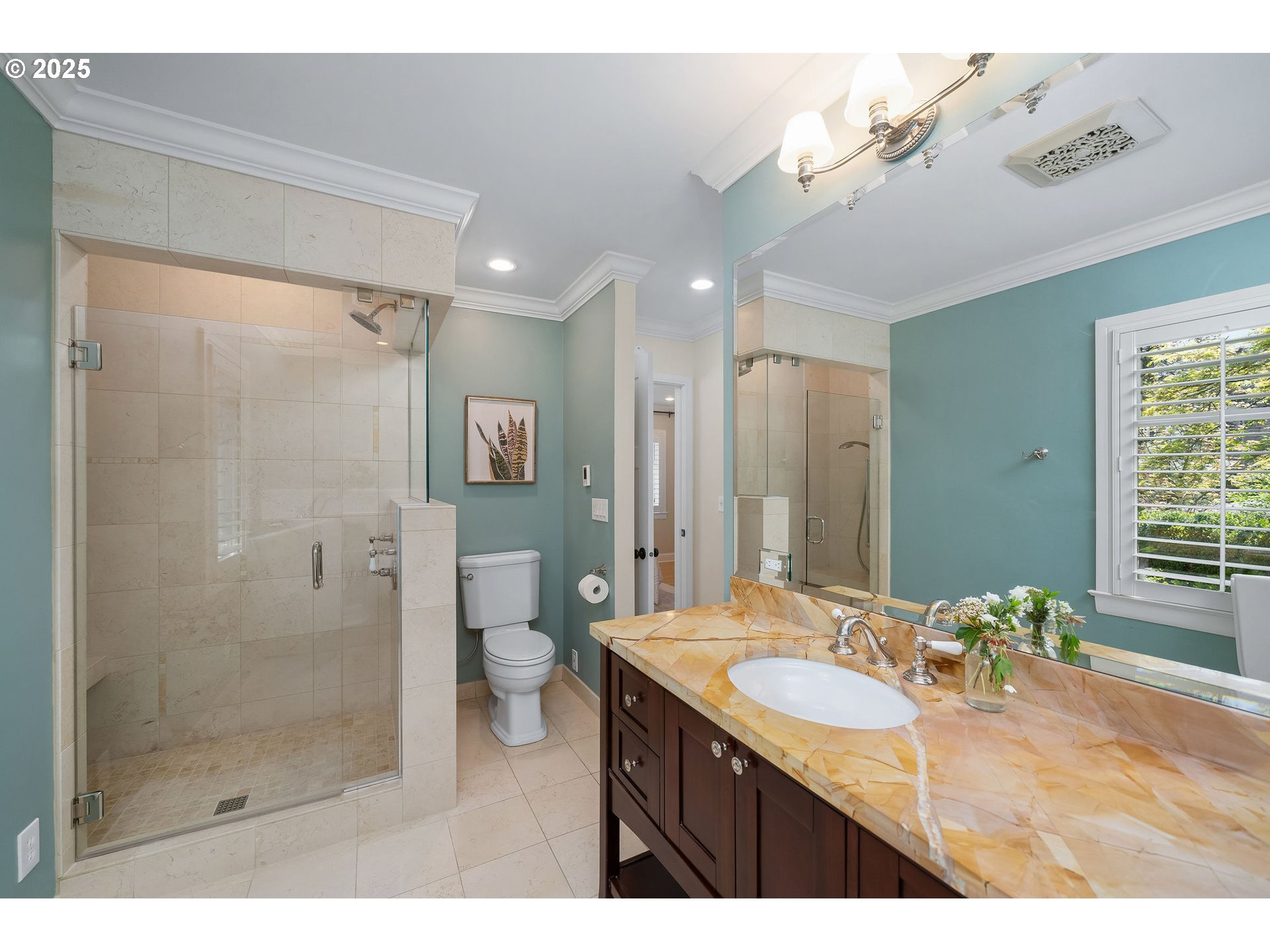 3940 Southwest Council Crest Drive Portland, OR 97239 - Photo 27 of 48 a bathroom with a granite countertop sink a toilet a mirror and shower