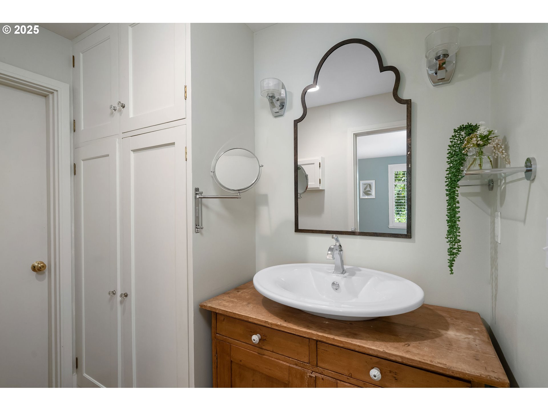 3940 Southwest Council Crest Drive Portland, OR 97239 - Photo 32 of 48 a bathroom with a sink and a mirror