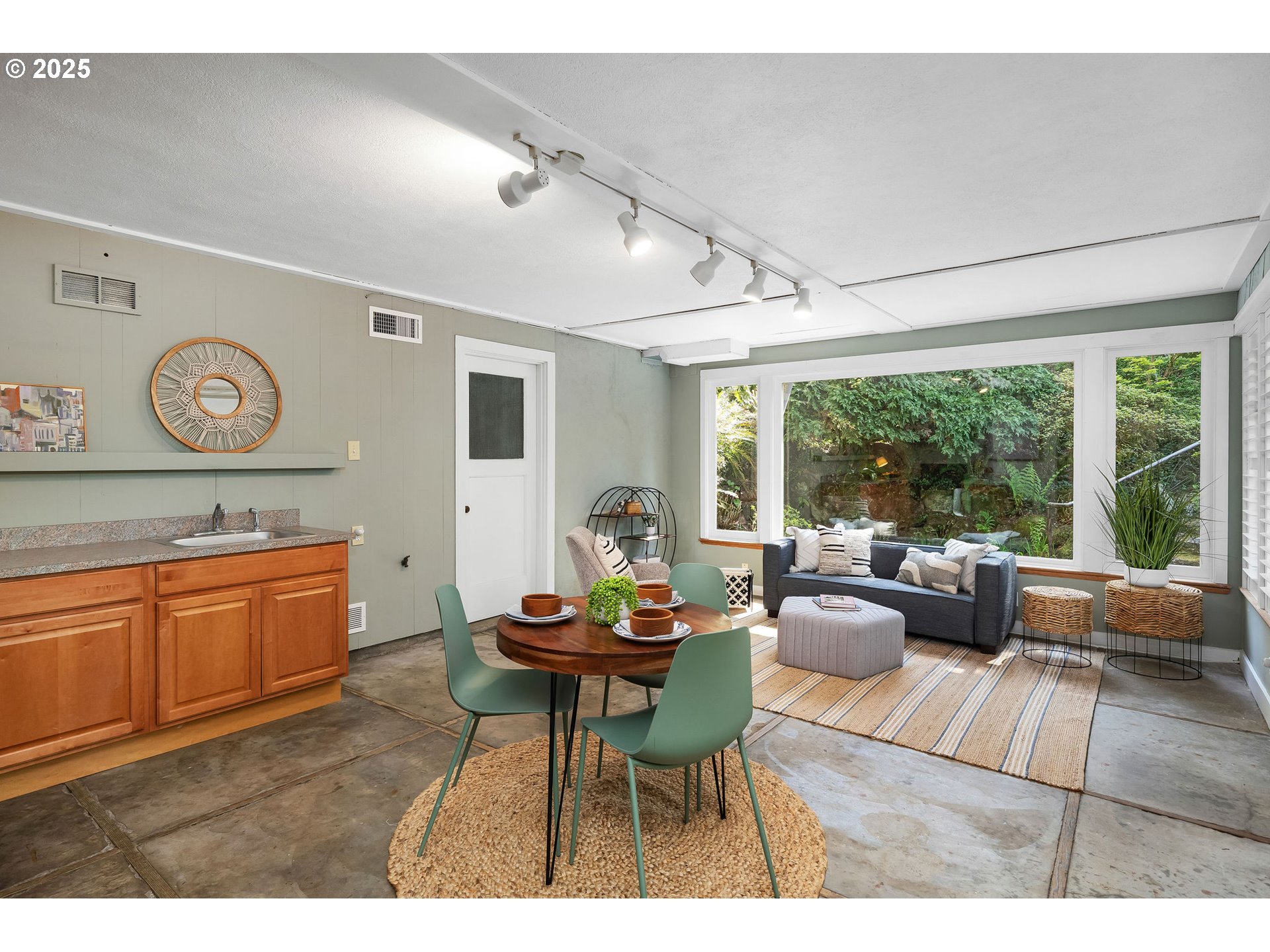 3940 Southwest Council Crest Drive Portland, OR 97239 - Photo 34 of 48 a living room with furniture and a large window