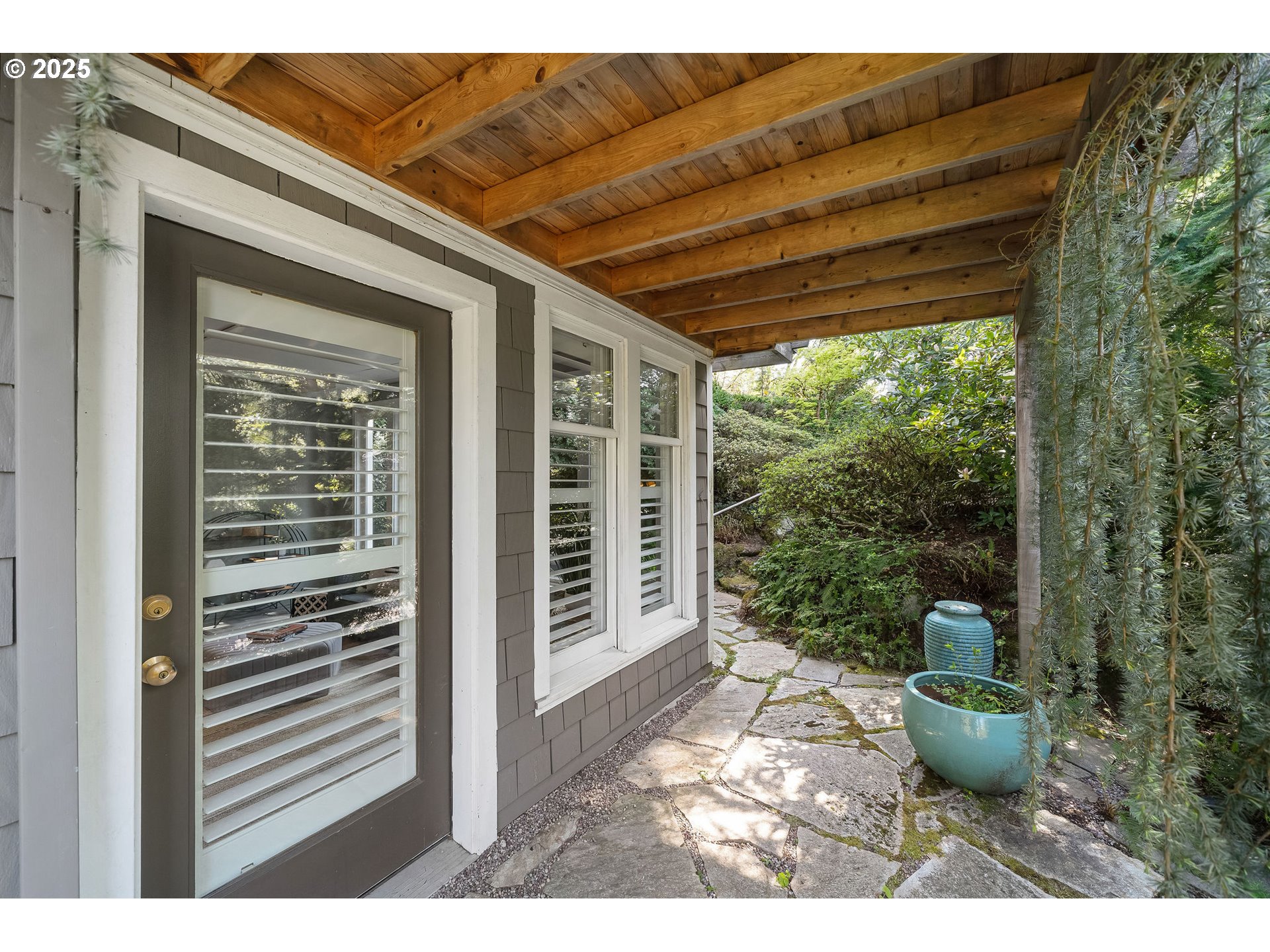3940 Southwest Council Crest Drive Portland, OR 97239 - Photo 40 of 48 a view of a patio with couches chair and tables