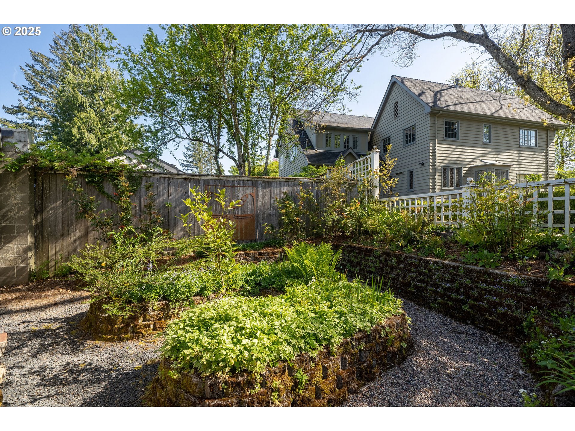 3940 Southwest Council Crest Drive Portland, OR 97239 - Photo 46 of 48 a front view of a house with a yard