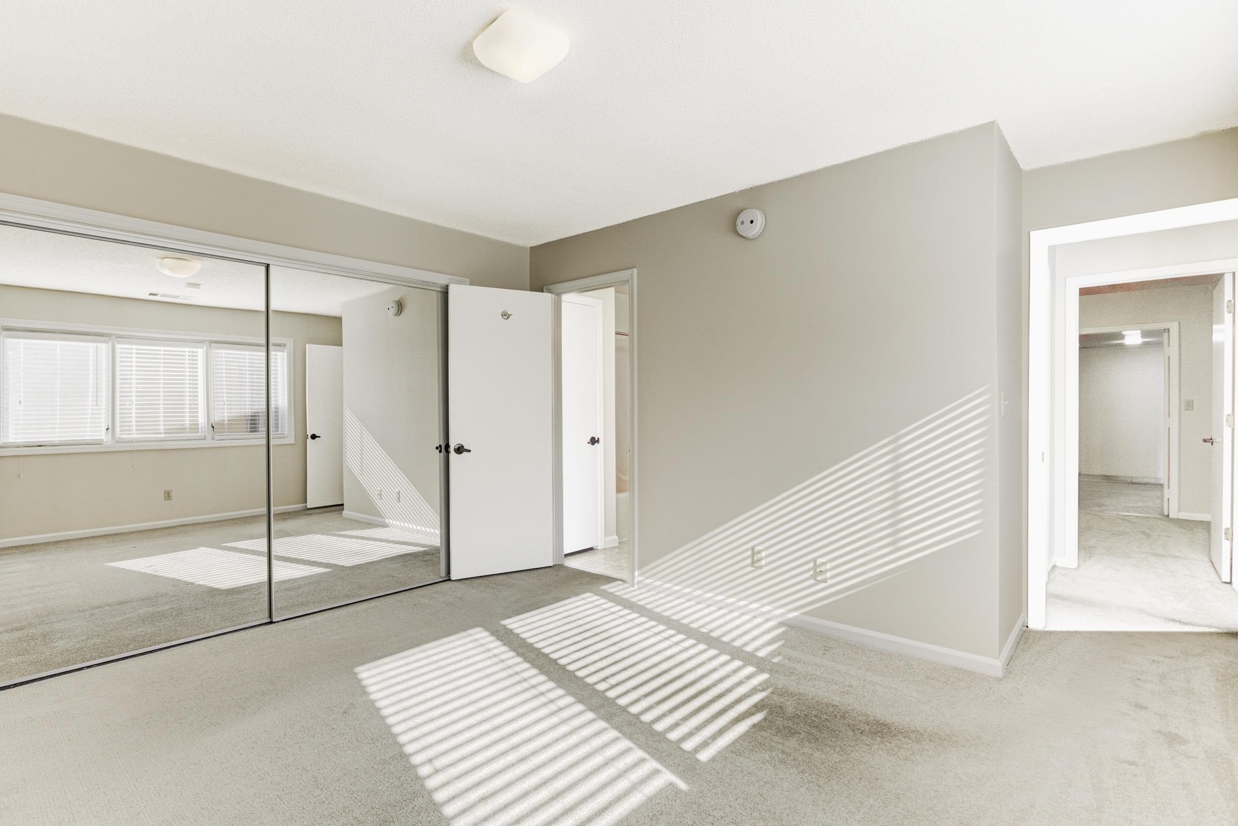 5013 Scheibler Road, Unit C1 Memphis, TN 38128 - Photo 12 of 36 a view of a bedroom with wooden floor and window