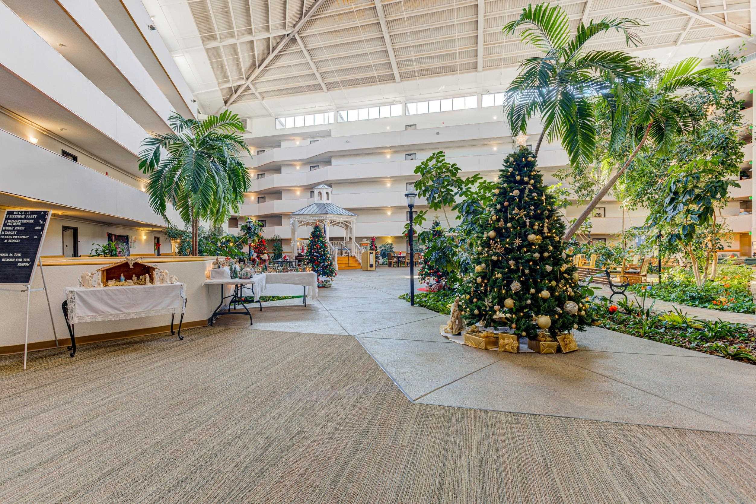 5013 Scheibler Road, Unit C1 Memphis, TN 38128 - Photo 24 of 36 a view of a patio with couches and a table and chairs with wooden floor and fence
