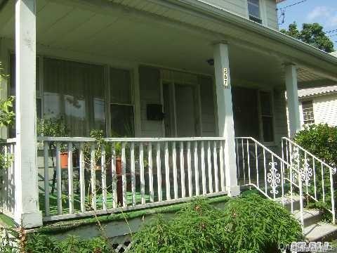 267 Schenck Avenue Great Neck, NY 11021 - Photo 2 of 9 View of property exterior featuring covered porch