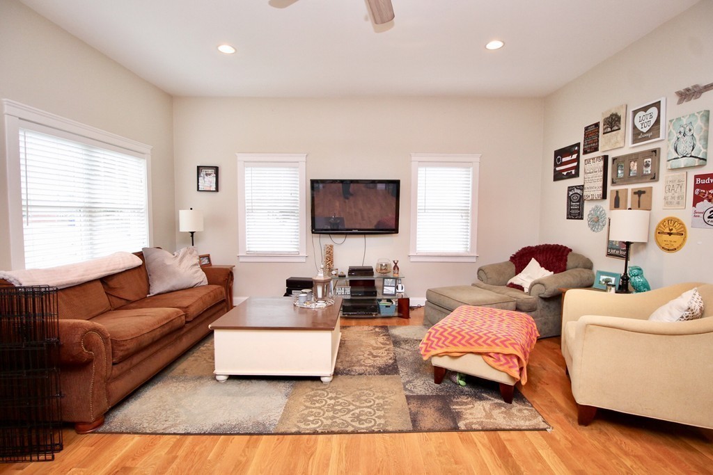 135 Argyle Road Braintree, MA 02184 - Photo 11 of 29 a living room with furniture and a flat screen tv