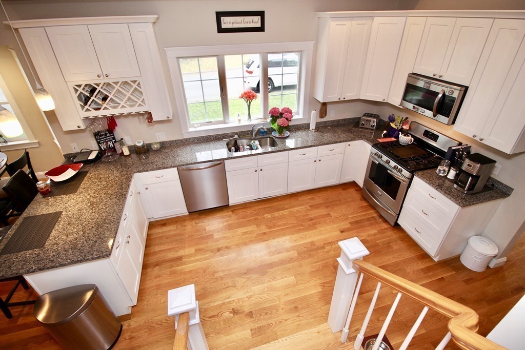 135 Argyle Road Braintree, MA 02184 - Photo 16 of 29 a kitchen with stainless steel appliances a stove a sink and a refrigerator