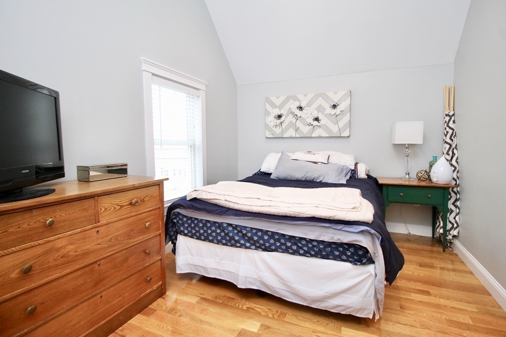 135 Argyle Road Braintree, MA 02184 - Photo 25 of 29 a bedroom with a bed and a flat screen tv