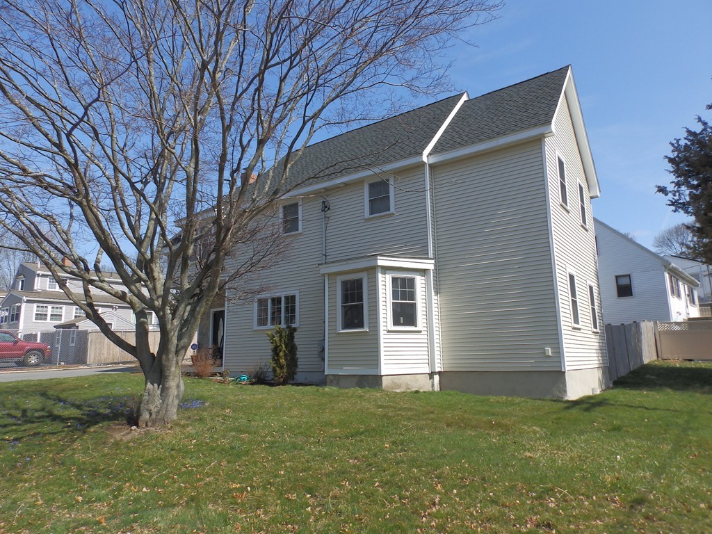 135 Argyle Road Braintree, MA 02184 - Photo 4 of 29 a backyard of a house with plants and large tree