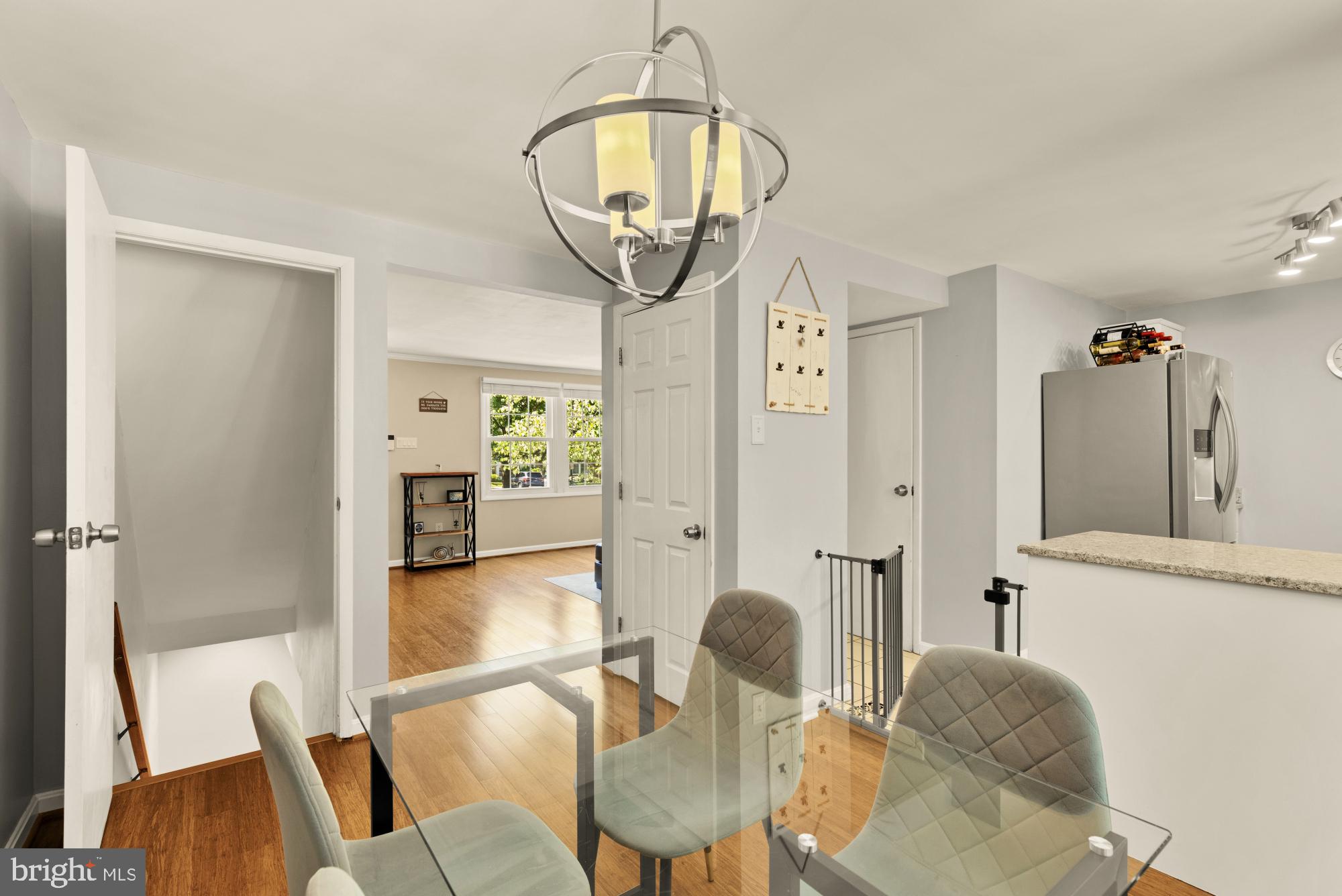 8100 Loving Forest Court Springfield, VA 22153 - Photo 10 of 33 a view of a dining room with furniture and wooden floor