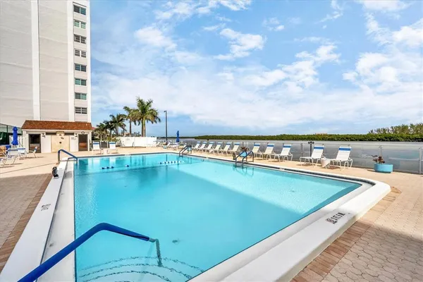 a view of swimming pool with outdoor space and seating