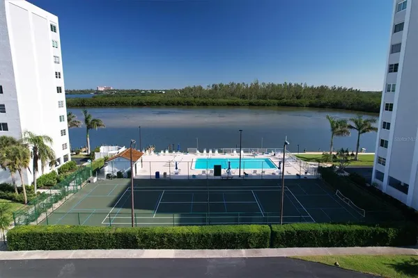 a view of balcony with wooden floor and outdoor seating