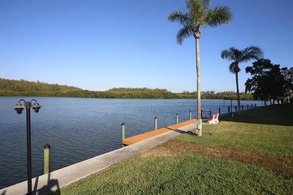 an aerial view of a house with a lake view