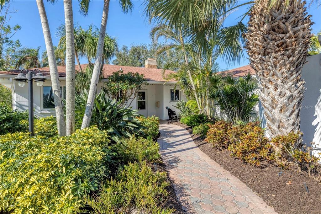 9393 Midnight Pass Road, Unit 302 Sarasota, FL 34242 - Photo 55 of 65 a view of a garden with plants