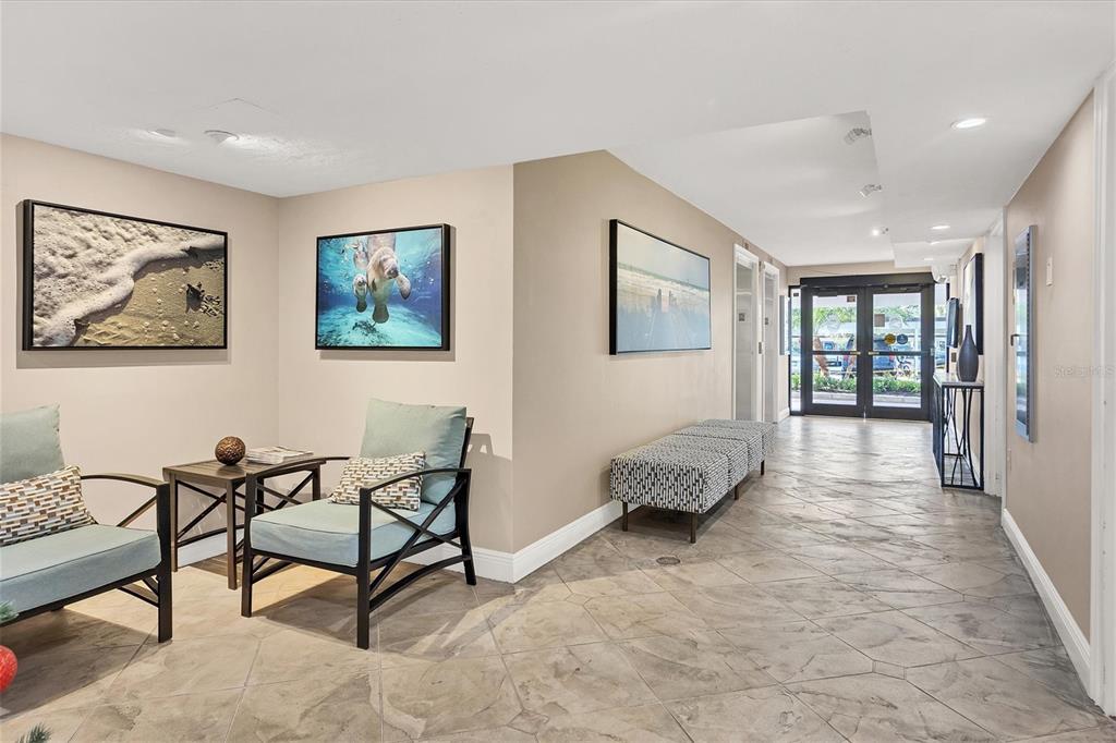 9393 Midnight Pass Road, Unit 302 Sarasota, FL 34242 - Photo 57 of 65 a living room with furniture and a window