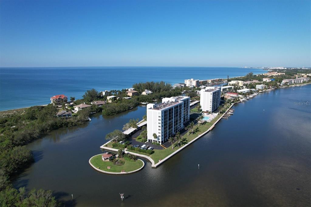 9393 Midnight Pass Road, Unit 302 Sarasota, FL 34242 - Photo 65 of 65 a view of a ocean with city from terrace