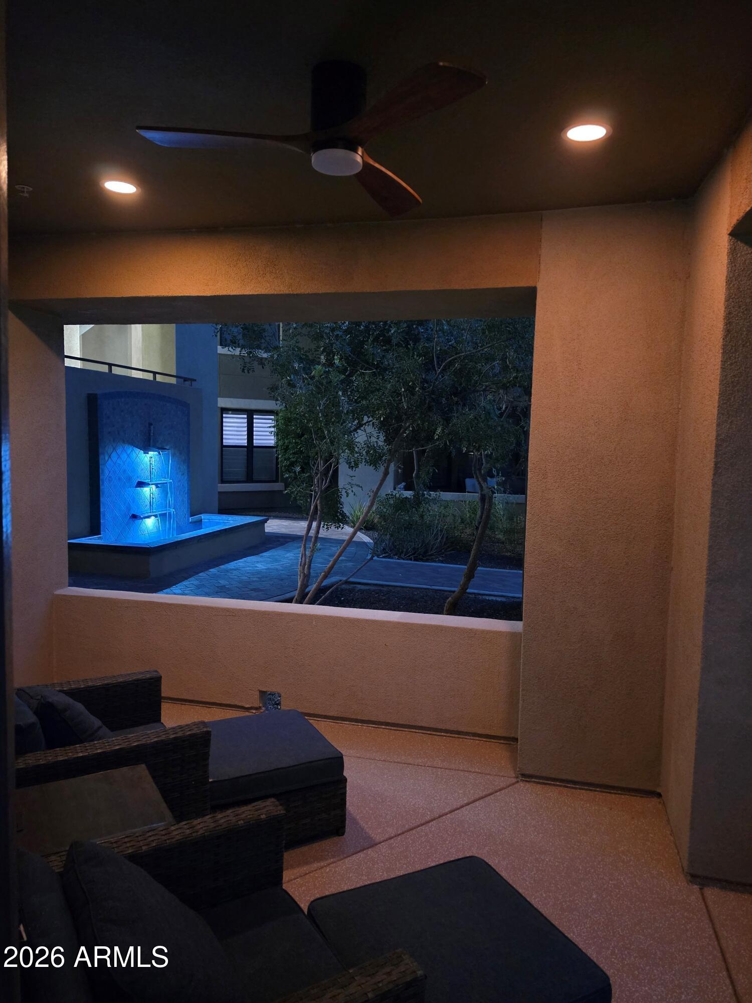 7601 East Indian Bend Road, Unit 1017 Scottsdale, AZ 85250 - Photo 31 of 49 a room with furniture and a fireplace