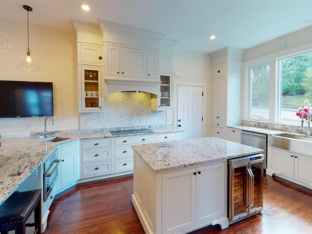 6 Kennard Road Brookline, MA 02445 - Photo 11 of 39 a kitchen with granite countertop sink stove and microwave