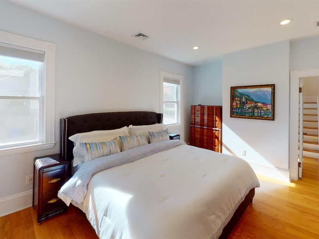 6 Kennard Road Brookline, MA 02445 - Photo 17 of 39 a bedroom with bed and wooden floor