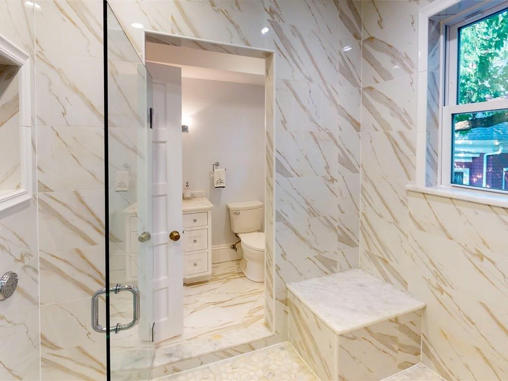 6 Kennard Road Brookline, MA 02445 - Photo 19 of 39 a bathroom with a bathtub and shower