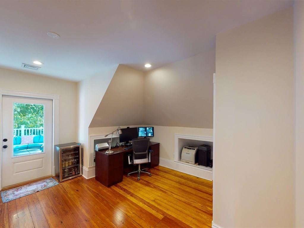 6 Kennard Road Brookline, MA 02445 - Photo 27 of 39 a room with furniture and a fireplace