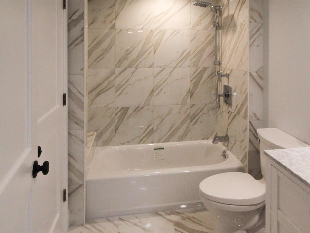 6 Kennard Road Brookline, MA 02445 - Photo 35 of 39 a bathroom with a toilet and a bathtub