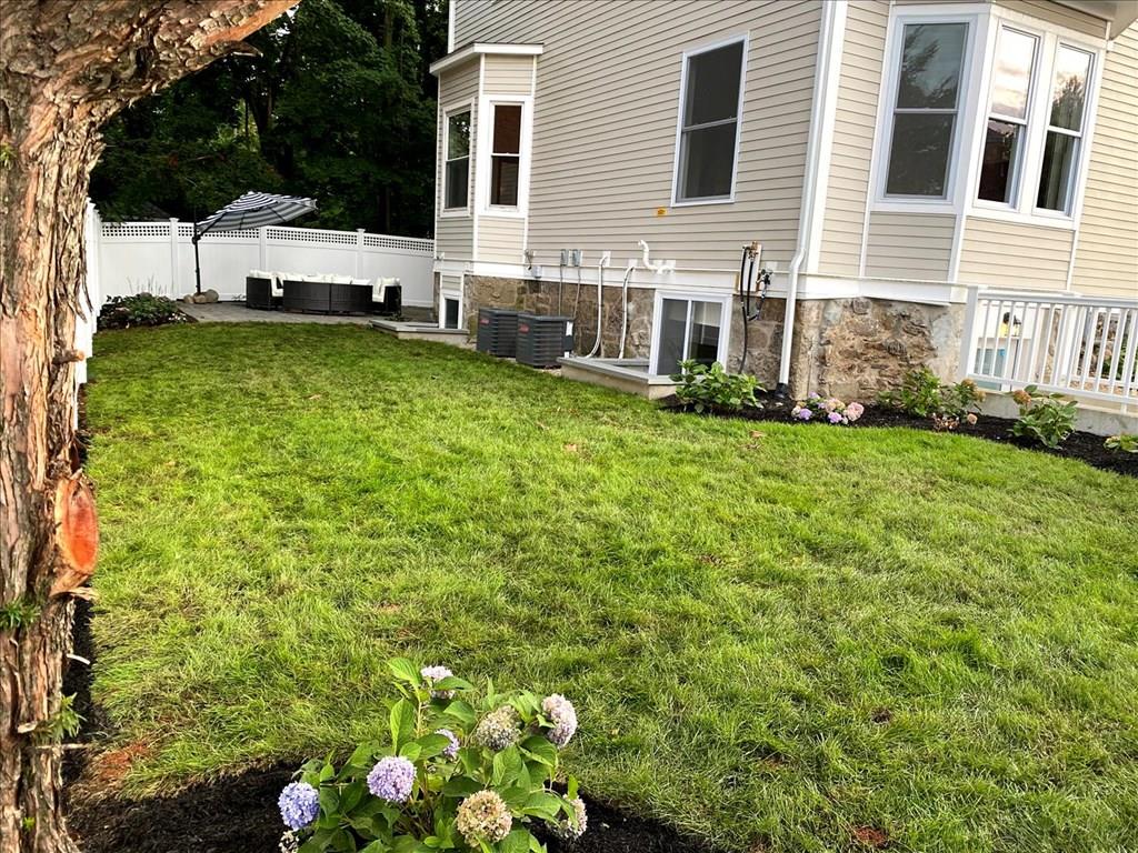 6 Kennard Road Brookline, MA 02445 - Photo 38 of 39 a view of a house with garden