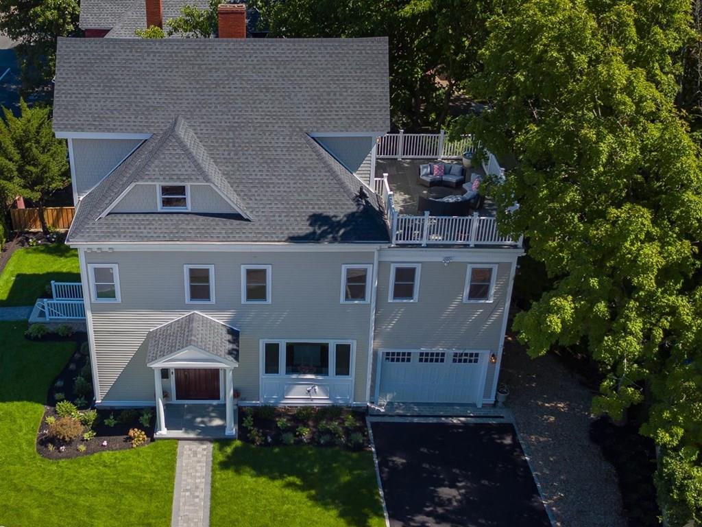 6 Kennard Road Brookline, MA 02445 - Photo 7 of 39 a aerial view of a house next to a yard