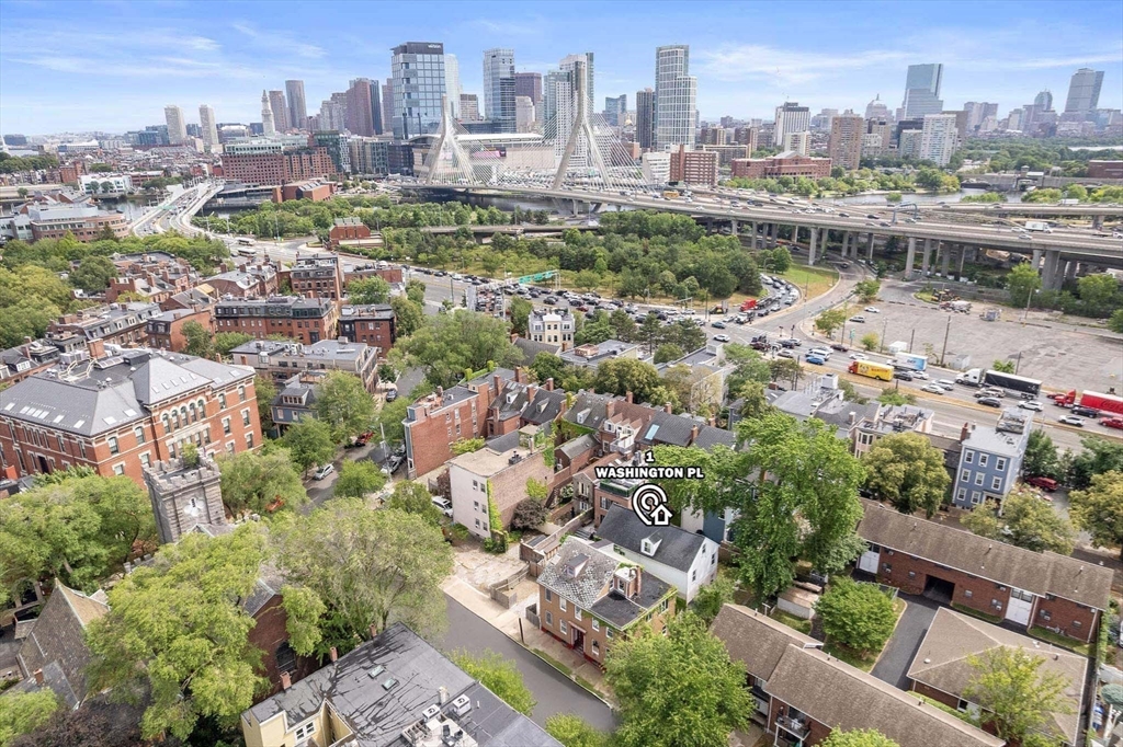 1 Washington Place Boston, MA 02129 - Photo 18 of 18 an aerial view of a city with buildings and lake